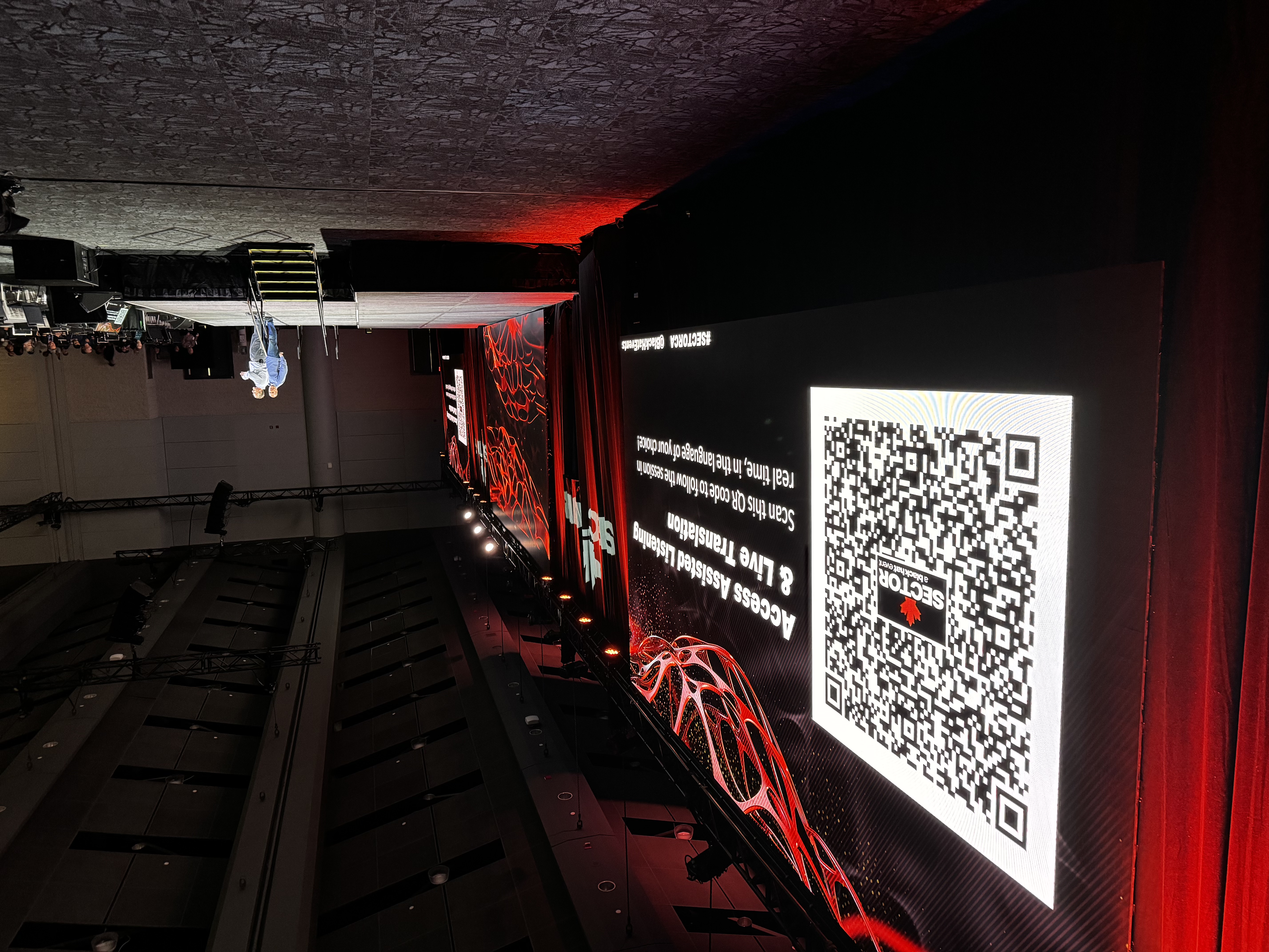 SecTor stage with a large QR code and assisted-listening and live-translation access instructions